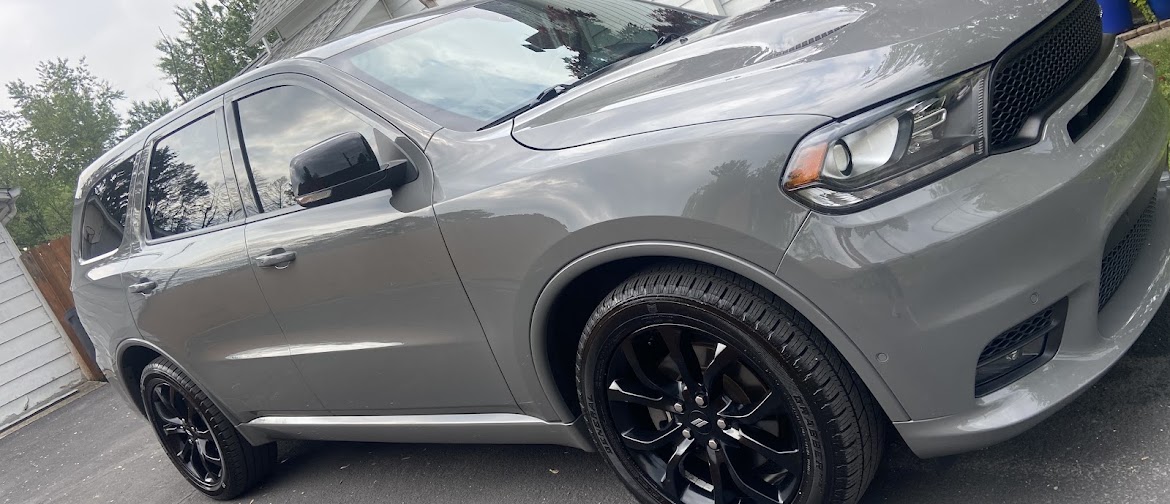 Gray Dodge Durango exterior after detailing by Finest Auto Detailing